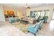 Inviting living room boasting neutral tones, tile flooring, comfortable seating and an attached kitchen at 1011 Cedar Bay Ln, Winter Springs, FL 32708