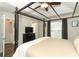 Spacious main bedroom featuring a canopy bed frame and wood laminate flooring at 1011 Cedar Bay Ln, Winter Springs, FL 32708
