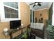 Relaxing porch featuring wicker furniture, a TV, and comfortable seating area at 1011 Cedar Bay Ln, Winter Springs, FL 32708