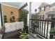 Inviting porch with comfortable wicker furniture and peaceful neighborhood views at 1011 Cedar Bay Ln, Winter Springs, FL 32708