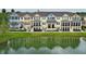 Charming townhome is reflected in the pond at 1011 Cedar Bay Ln, Winter Springs, FL 32708