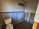 Bathroom with exposed pipes, new tile, and modern lighting is undergoing renovations at 1019 Chippewa Trl, Daytona Beach, FL 32117