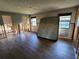 Bedroom featuring wood-look floors and natural light, showcasing renovation work at 1019 Chippewa Trl, Daytona Beach, FL 32117