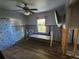 Bedroom featuring wood-look floors and natural light, showcasing renovation work at 1019 Chippewa Trl, Daytona Beach, FL 32117