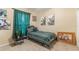 A stylish bedroom with vibrant green curtains and patterned bedding, creating a cozy atmosphere at 10321 Pebblestone Ct, Leesburg, FL 34788