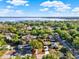 Aerial view outlining property boundaries, highlighting the home's location near a large lake at 1179 Seminole St, Clermont, FL 34711