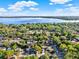 Aerial view of the neighborhood, showing lush trees, roads, and a distant lake at 1179 Seminole St, Clermont, FL 34711