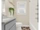 Bathroom with modern vanity, decorative tile floor, and shower-tub combo at 1179 Seminole St, Clermont, FL 34711