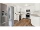 Well-appointed kitchen with stainless steel appliances, white cabinets, and modern finishes at 1179 Seminole St, Clermont, FL 34711