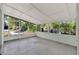 Enclosed patio featuring concrete floor, glass windows, and screens offers indoor-outdoor living at 1179 Seminole St, Clermont, FL 34711