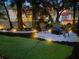 Backyard featuring a unique seating area with Adirondack chairs surrounding a fire pit at 1213 Brampton Pl, Lake Mary, FL 32746
