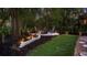 Backyard featuring a unique seating area with Adirondack chairs surrounding a fire pit at 1213 Brampton Pl, Lake Mary, FL 32746