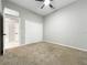Neutral bedroom with a ceiling fan, carpeted floor, and a closet at 1213 Brampton Pl, Lake Mary, FL 32746