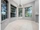 Cozy breakfast nook filled with natural light, featuring a modern chandelier and tile floors at 1213 Brampton Pl, Lake Mary, FL 32746