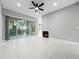 Open living room boasts cozy fireplace and sliding glass doors to the outdoor space at 1213 Brampton Pl, Lake Mary, FL 32746