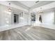 Bright and airy living room with neutral paint, tile and wood floors, and modern lighting at 1213 Brampton Pl, Lake Mary, FL 32746