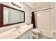 Bathroom featuring a shower/tub combo, tile flooring, large mirror, toilet and vanity at 1232 Roma Ct, Orlando, FL 32825