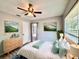 Bedroom features wood-look tile flooring, ceiling fan, and a dresser at 1232 Roma Ct, Orlando, FL 32825