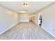 Open living area with wood-look tile floors, neutral walls, and recessed lighting creating a welcoming atmosphere at 1232 Roma Ct, Orlando, FL 32825