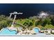 Stunning aerial view of community pool, dock, and lake creating a resort-like atmosphere at 13427 Blue Heron Beach Dr # 1802, Orlando, FL 32821