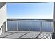 Balcony overlooking the water, partially shaded, features metal railings for safety at 13427 Blue Heron Beach Dr # 1802, Orlando, FL 32821