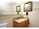 Well-lit bathroom with vanity, ample counter space, and modern fixtures at 13427 Blue Heron Beach Dr # 1802, Orlando, FL 32821