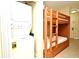 Bunk beds adjacent to a stackable washer and dryer at 13427 Blue Heron Beach Dr # 1802, Orlando, FL 32821