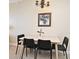 Dining room with table, four chairs, and a chandelier at 13427 Blue Heron Beach Dr # 1802, Orlando, FL 32821