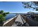 Scenic view of the community dock with gazebo at the end of the pier overlooking the beautiful lake at 13427 Blue Heron Beach Dr # 1802, Orlando, FL 32821