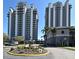Luxury condos showcase modern architecture, fountain, and manicured landscaping enhancing curb appeal at 13427 Blue Heron Beach Dr # 1802, Orlando, FL 32821