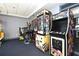 Entertainment in the game room that includes multiple arcade games for community recreation at 13427 Blue Heron Beach Dr # 1802, Orlando, FL 32821