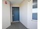 Condo entrance hallway featuring a neutral color scheme and modern door for secure entry at 13427 Blue Heron Beach Dr # 1802, Orlando, FL 32821