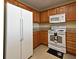 Kitchen featuring stainless steel refrigerator, microwave and stove at 13427 Blue Heron Beach Dr # 1802, Orlando, FL 32821