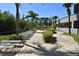 Outdoor community lounge area with seating near the lake and condominium units at 13427 Blue Heron Beach Dr # 1802, Orlando, FL 32821