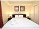 Comfortable bedroom featuring a king-size bed, soft lighting, and closet for ample storage at 13427 Blue Heron Beach Dr # 1802, Orlando, FL 32821