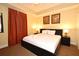 Inviting bedroom with a king-size bed, ambient lighting, and cozy decor for a relaxing retreat at 13427 Blue Heron Beach Dr # 1802, Orlando, FL 32821