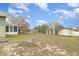 Wide backyard with shed, enclosed porch, and privacy fence at 14325 Golden View Dr, Grand Island, FL 32735