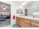 Bathroom featuring a double sink vanity with wood cabinets at 14325 Golden View Dr, Grand Island, FL 32735