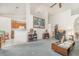 Spacious living room featuring vaulted ceilings, a ceiling fan, and an open floor plan at 14325 Golden View Dr, Grand Island, FL 32735