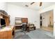 Office with desk and workspace, neutral wall color, and an overhead ceiling fan at 14325 Golden View Dr, Grand Island, FL 32735