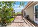 Backyard with a wooden deck, pergola, and slider that leads into the home at 1564 Cavendish Rd, Winter Park, FL 32789