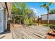 Expansive backyard with wooden deck, lush plants, and a relaxed outdoor ambiance at 1564 Cavendish Rd, Winter Park, FL 32789