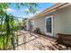 Backyard with a wood deck, mature trees and a back door leading into the home at 1564 Cavendish Rd, Winter Park, FL 32789