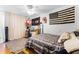 Comfortable bedroom featuring striped bedding, American themed decor, and ample space at 1564 Cavendish Rd, Winter Park, FL 32789