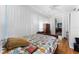 Bedroom featuring hardwood floors, a cozy bed, and bright natural light at 1564 Cavendish Rd, Winter Park, FL 32789