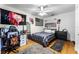 Cozy bedroom with striped bedding, American themed decor, and functional furniture at 1564 Cavendish Rd, Winter Park, FL 32789