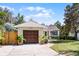 A charming one-story home features a lush lawn and an attached garage at 1564 Cavendish Rd, Winter Park, FL 32789