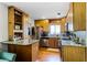 Bright kitchen with stainless steel appliances, ample wood cabinets, and granite countertops at 1564 Cavendish Rd, Winter Park, FL 32789