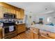 A spacious kitchen boasts stainless steel appliances and light wood cabinets at 1564 Cavendish Rd, Winter Park, FL 32789