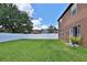 Spacious backyard with lush green grass and a white fence at 1750 Morning Sky Dr, Winter Garden, FL 34787
